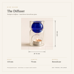 Size guide graphic for 'The Diffuser' tealight oil diffuser, showing a hand-blown borosilicate glass diffuser with a lit tealight candle inside. The diffuser features a translucent teal light blue glass body with a glossy cobalt blue top sphere.